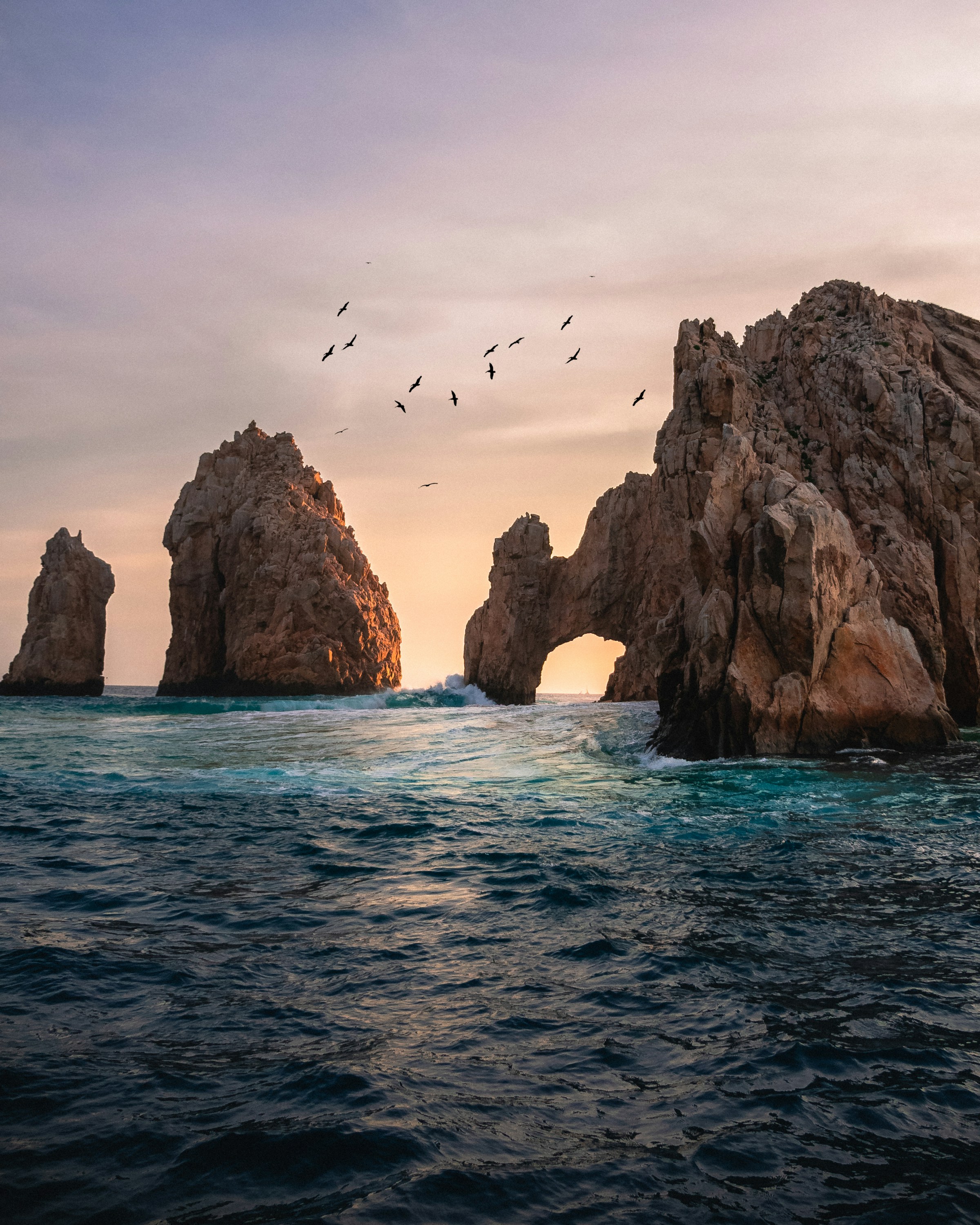 The Arch of Cabo San Lucas rising from the sea at sunset